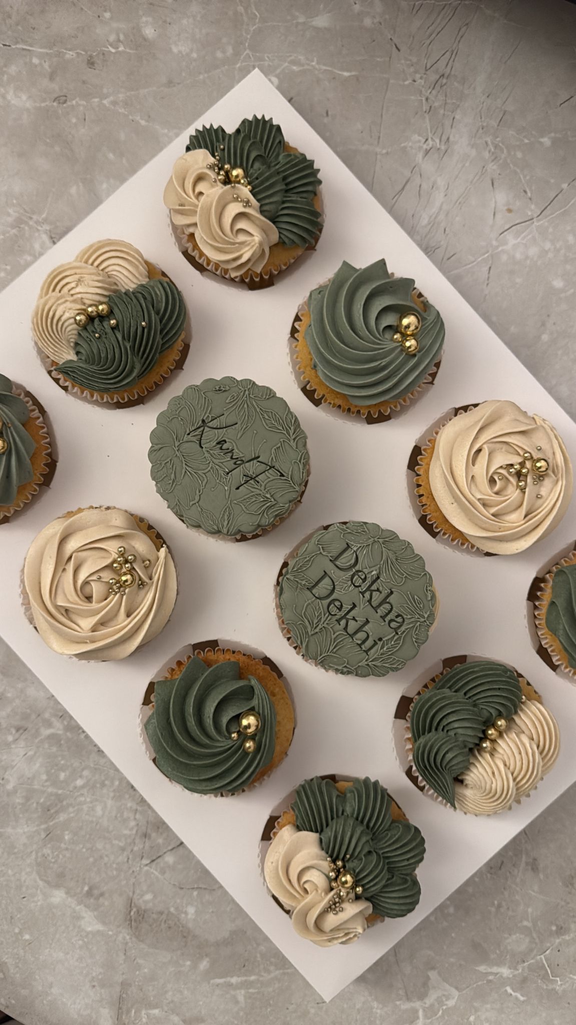 Assorted cupcakes topped with buttercream swirls and sprinkles